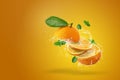 Water splashing on Fresh Sliced ââoranges fruit on Orange background Royalty Free Stock Photo